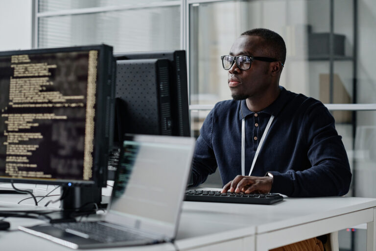 a computer engineer works on a desktop