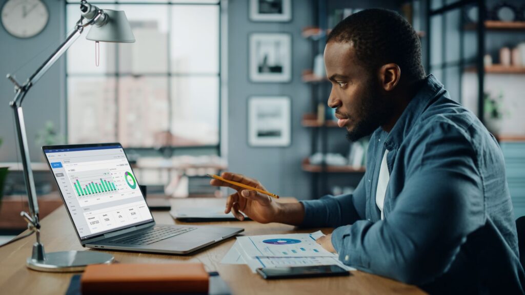 a person looking at a chart on their laptop