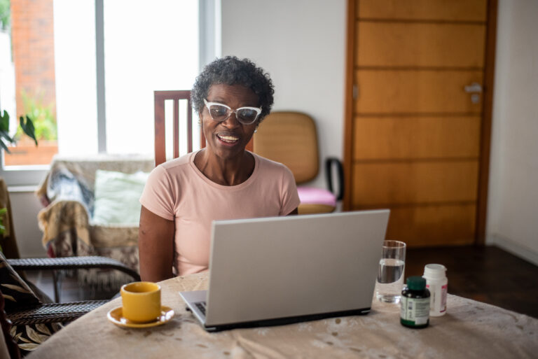 older adult doing research on computer