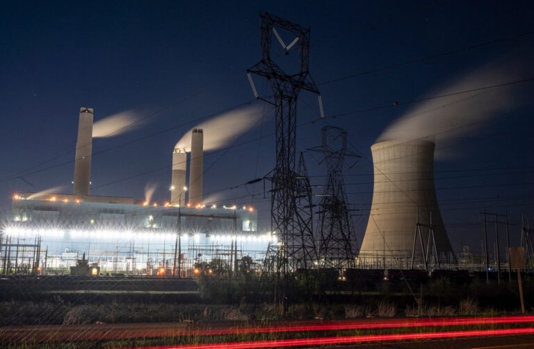 Steam rises from the Miller coal Power Plant