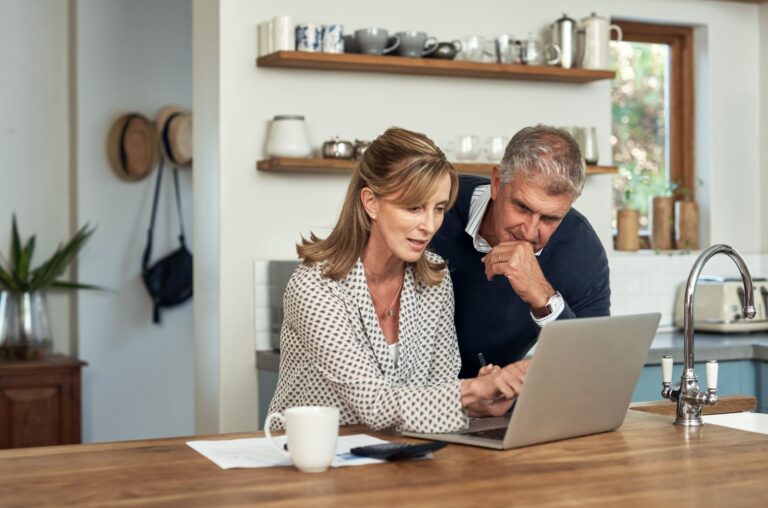 a couple looking at a computer screen