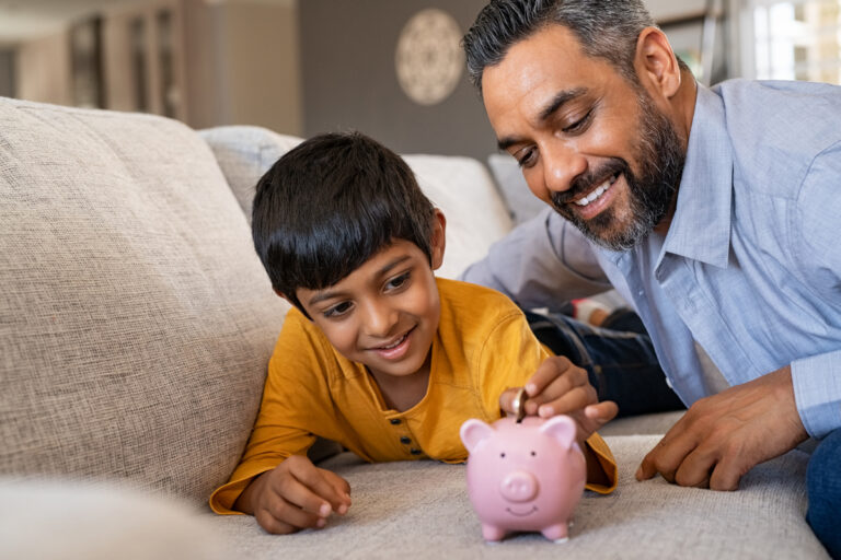 family child saving piggy bank financial lessons save money 1200x800 5b2df79