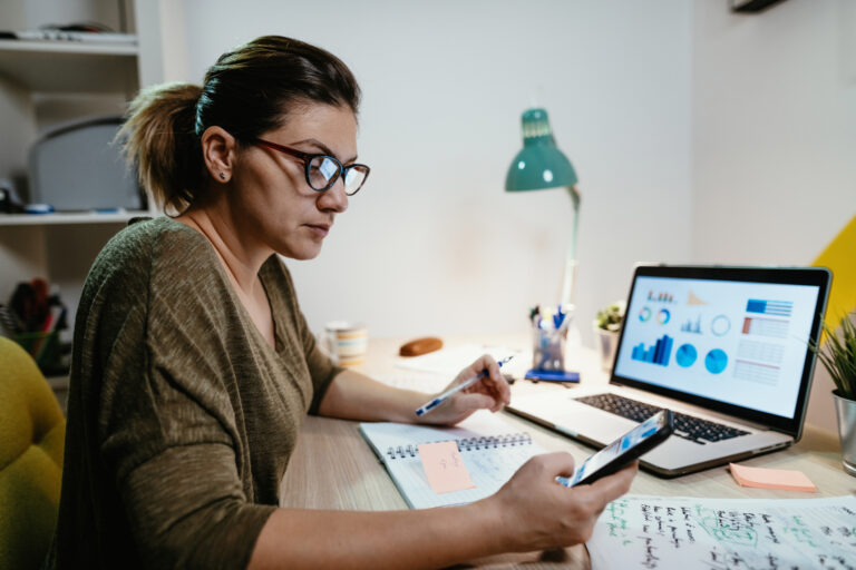 female investor reviewing her portfolio on a laptop