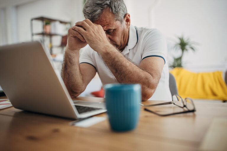 older man laptop upset