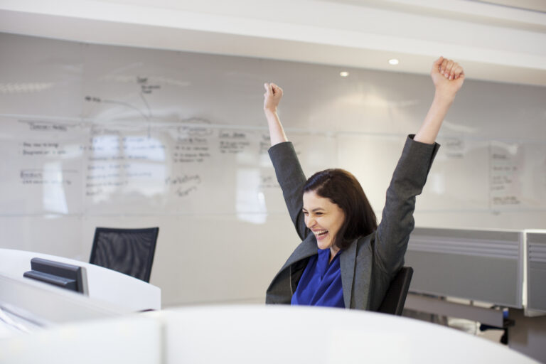 person celebrating in their office